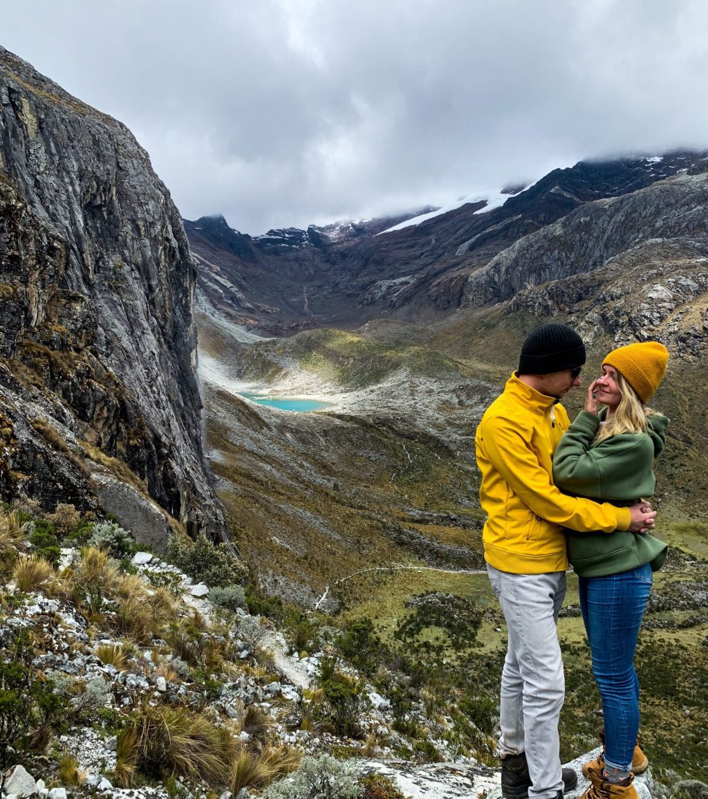 couple-embracing-on-scenic-mountain-top-2026-03-17-21-32-10-utc