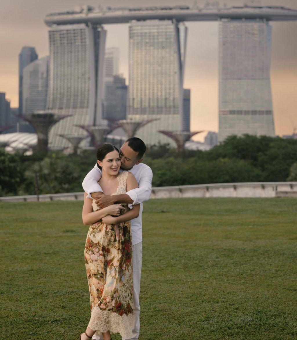 International couple embracing near Marina Bay Sands Singapore. High quality photo