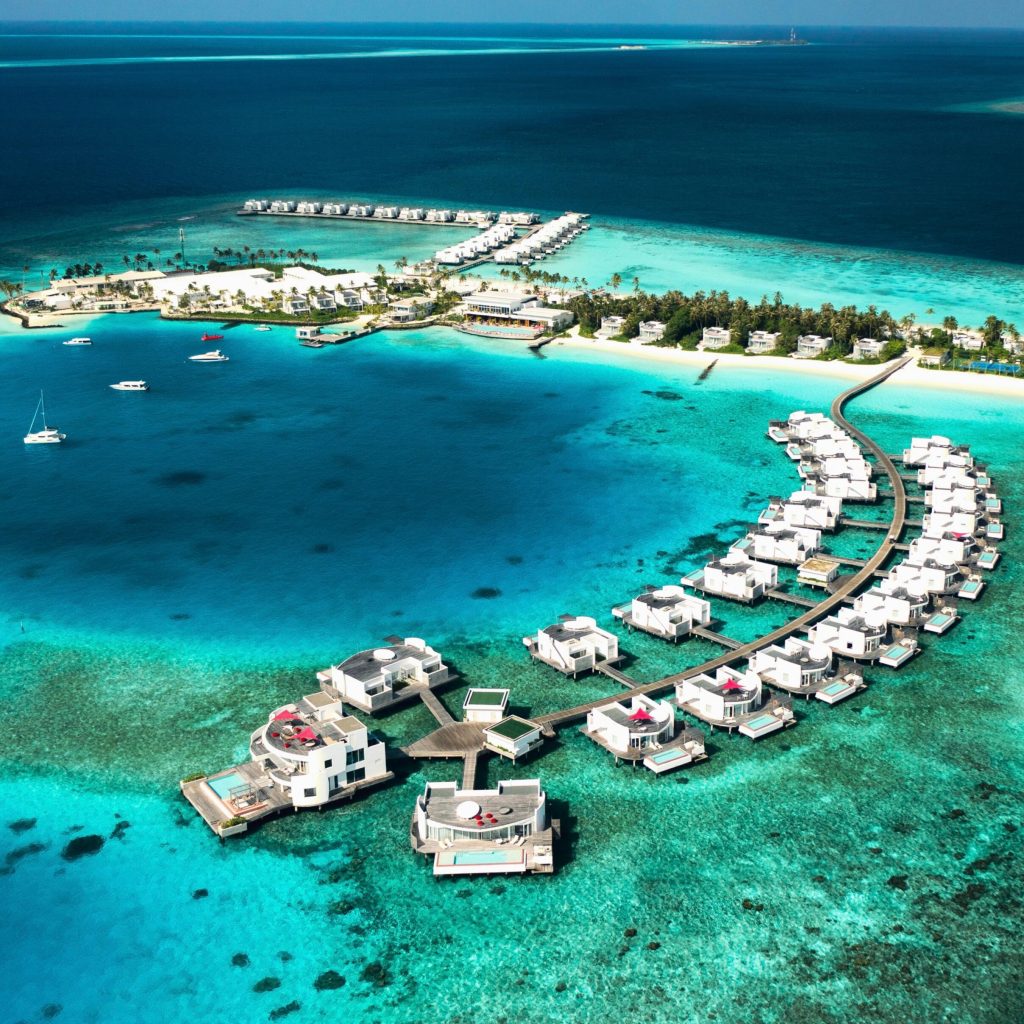 Maldives island resort with white-sand beach and crystal-clear ocean